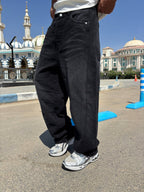 Black balloon jeans — angled view