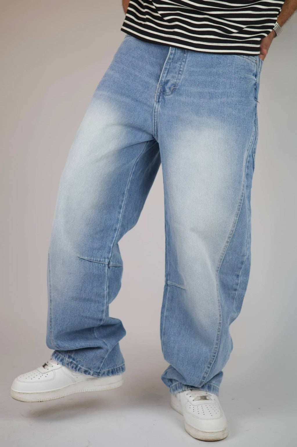 Light blue vintage wash balloon jeans — angled view