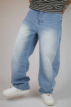 Light blue vintage wash balloon jeans — angled view