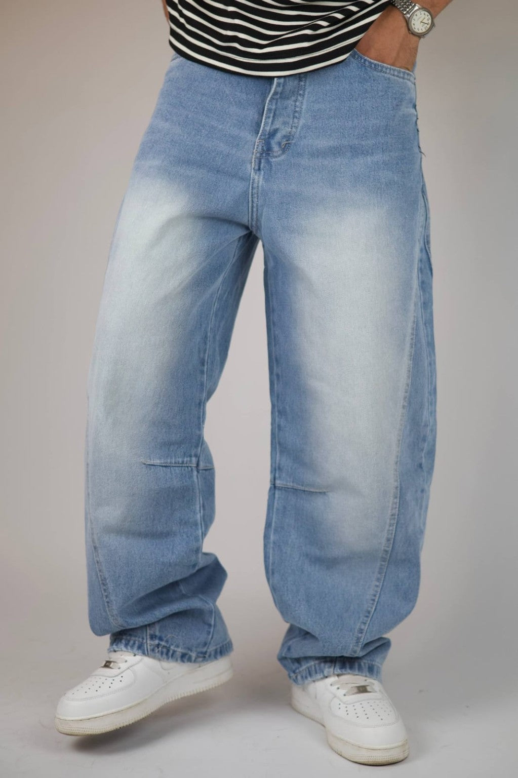 Light blue vintage wash balloon jeans — three-quarter view