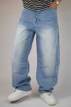 Light blue vintage wash balloon jeans — three-quarter view